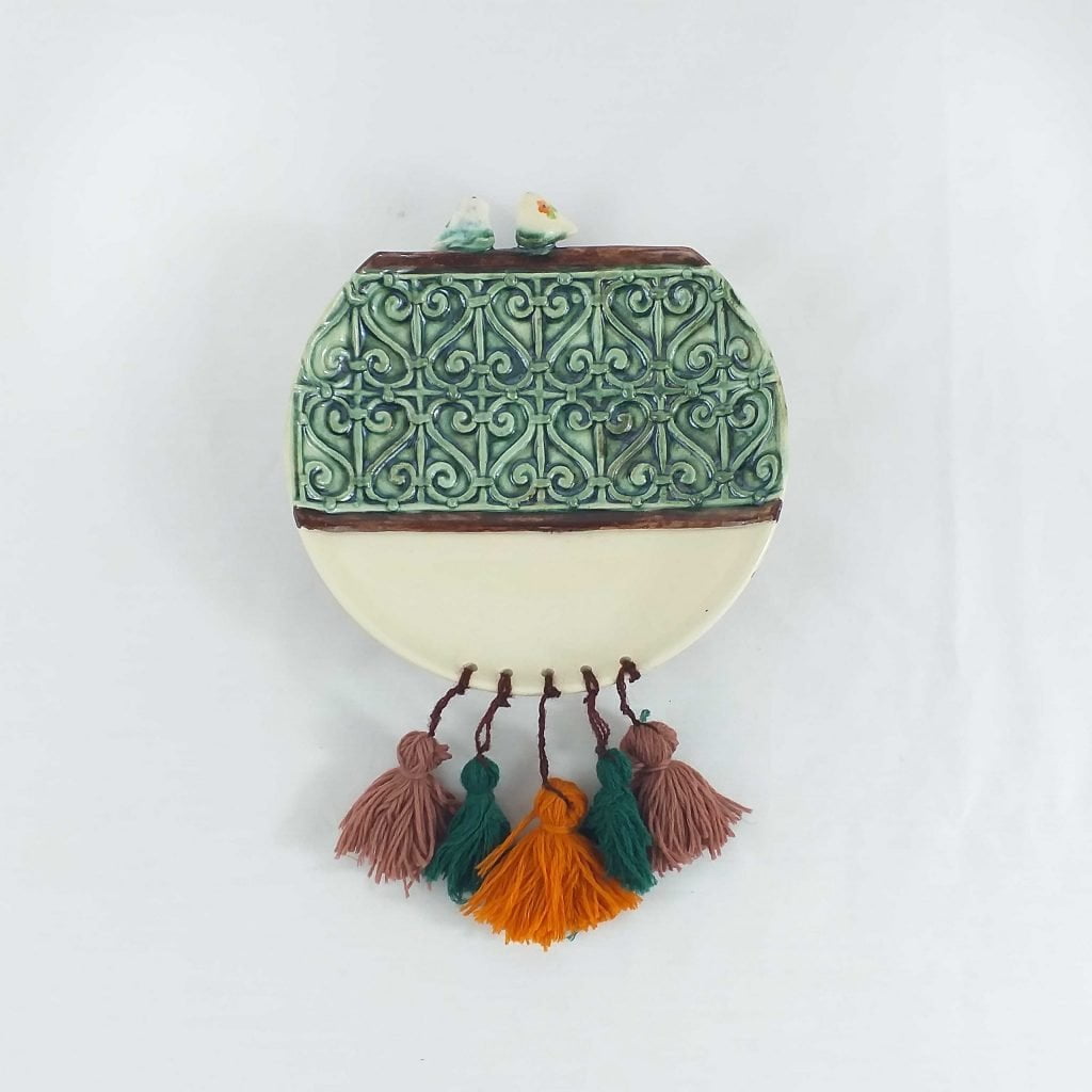 Wrought Iron Ceramic Wall Plates with birds statue on top