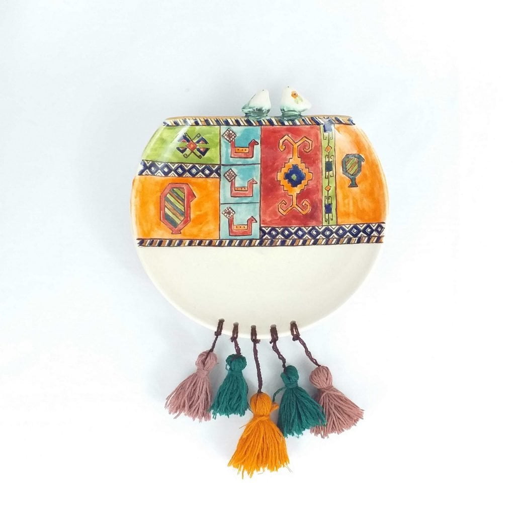 Old Windows ceramic wall plates photographed from front angle on wall