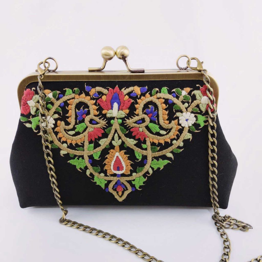 NEEDLEWORK CANVAS CLUTCH, WHITE Handmade structured canvas clutch decorated with needlework inspired by Persian art. Light milky color Size 27 * 13 All-embroidered needlework Fixed color yarn on linen fabric Project Name: Blue Shrub Washable