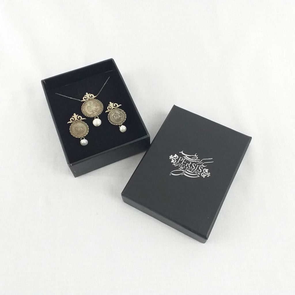 Close-up of Pahlavi coins with intricate engravings and mint details