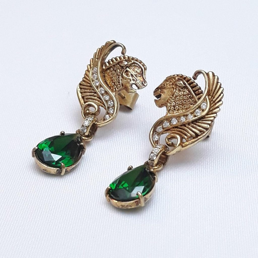 two gold plated huma bird earrings