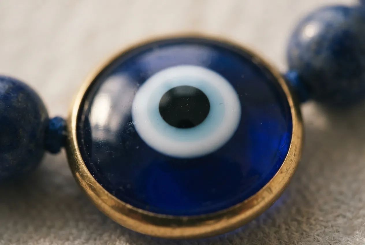 Close up of a blue and white evil eye bracelet